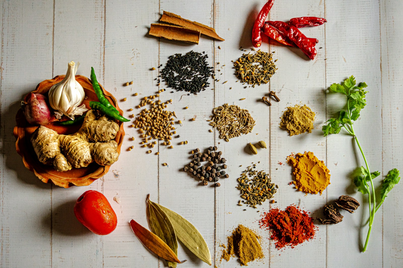 Colorful spices and herbs arranged for a specialty food product